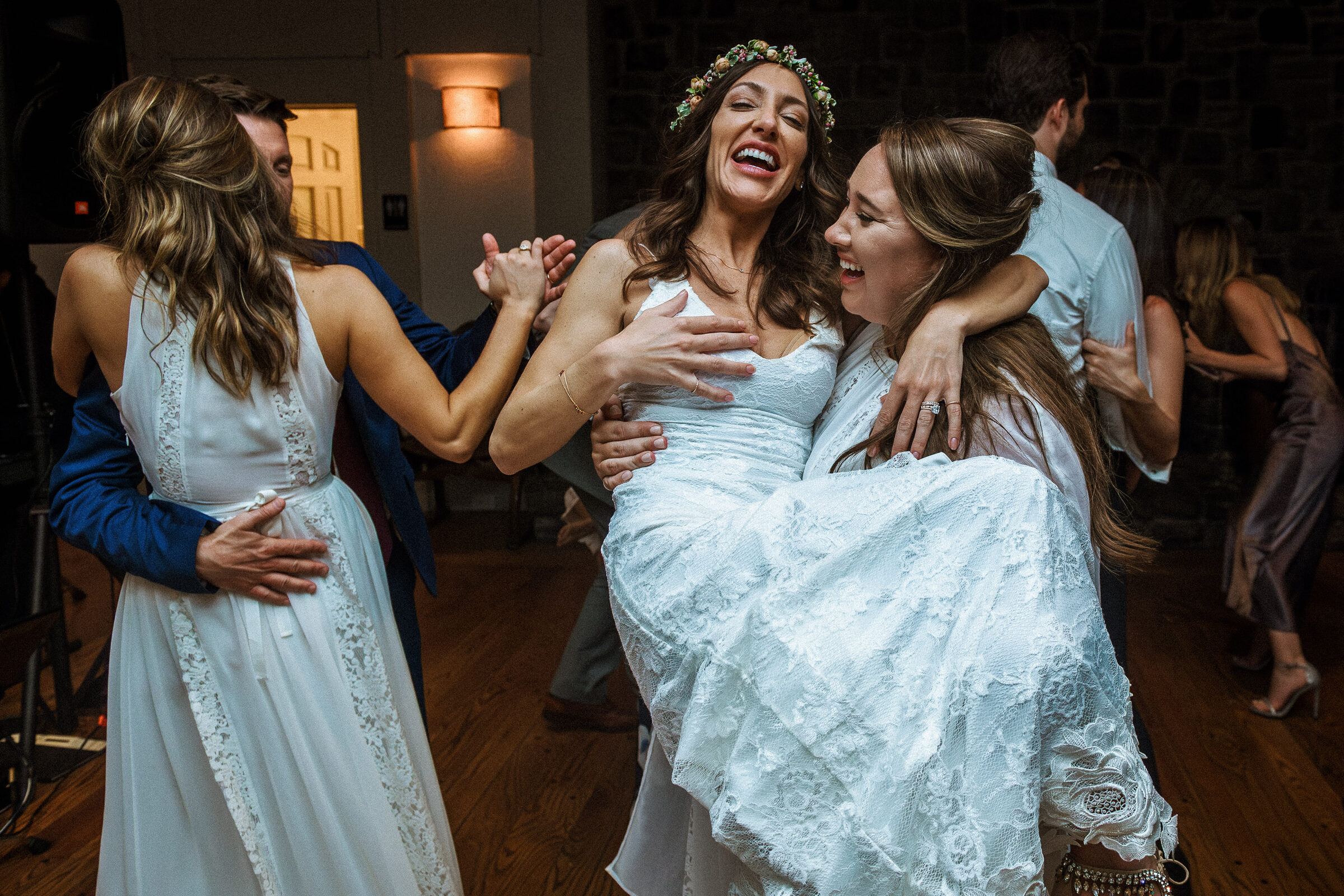 Emotional wedding photography as a joyful bride celebrates with friends in Napa Valley