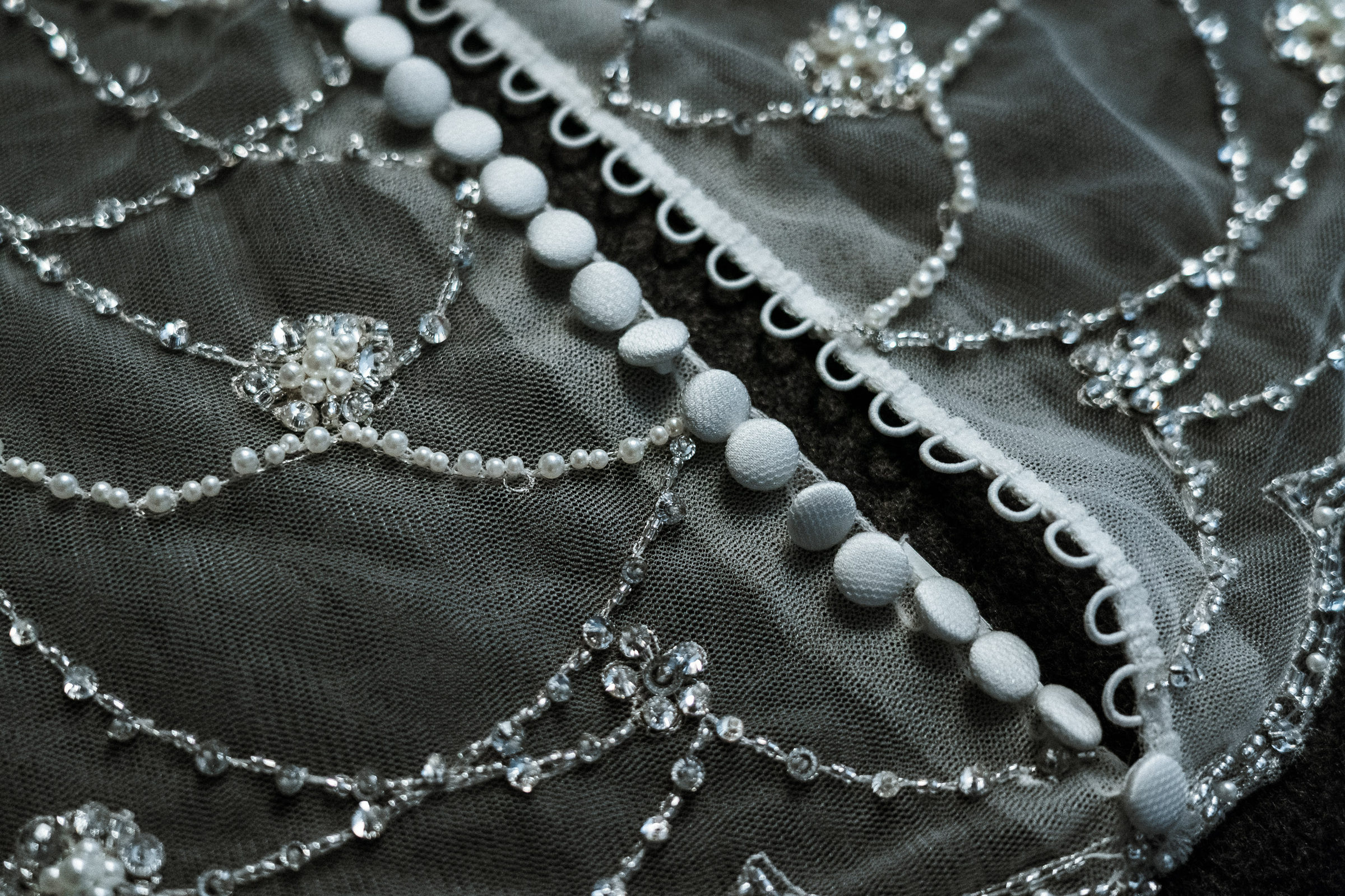 Pearl and crystal beadwork along the back of the wedding gown