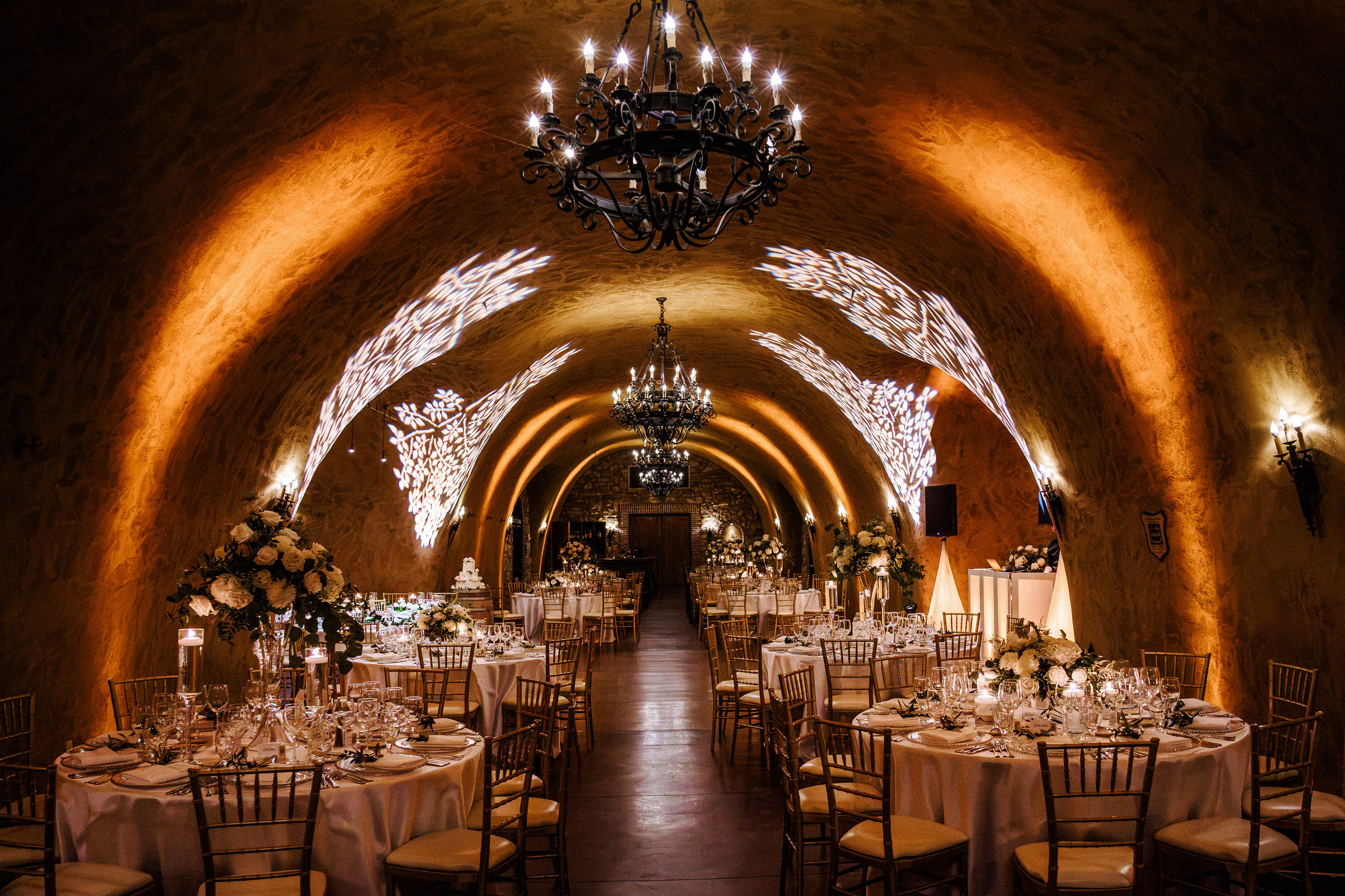 Estate Cave at The Meritage Resort set for dinner beneath vaulted stone arches