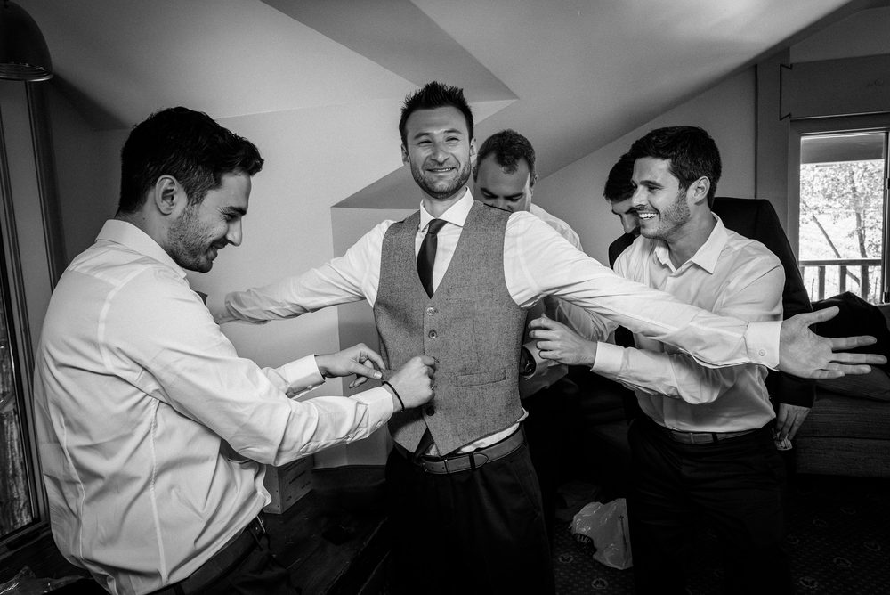 Groom getting ready with his groomsmen for a Harvest Inn wedding in Napa Valley