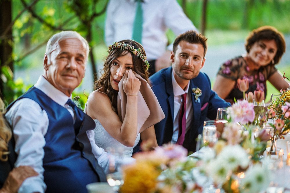 Bride sharing an emotional moment with family during a Napa Valley wedding reception