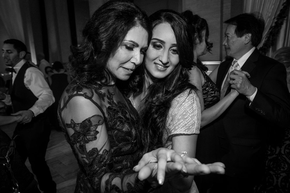 Bride showing her wedding ring during a joyful Bently Reserve reception in San Francisco