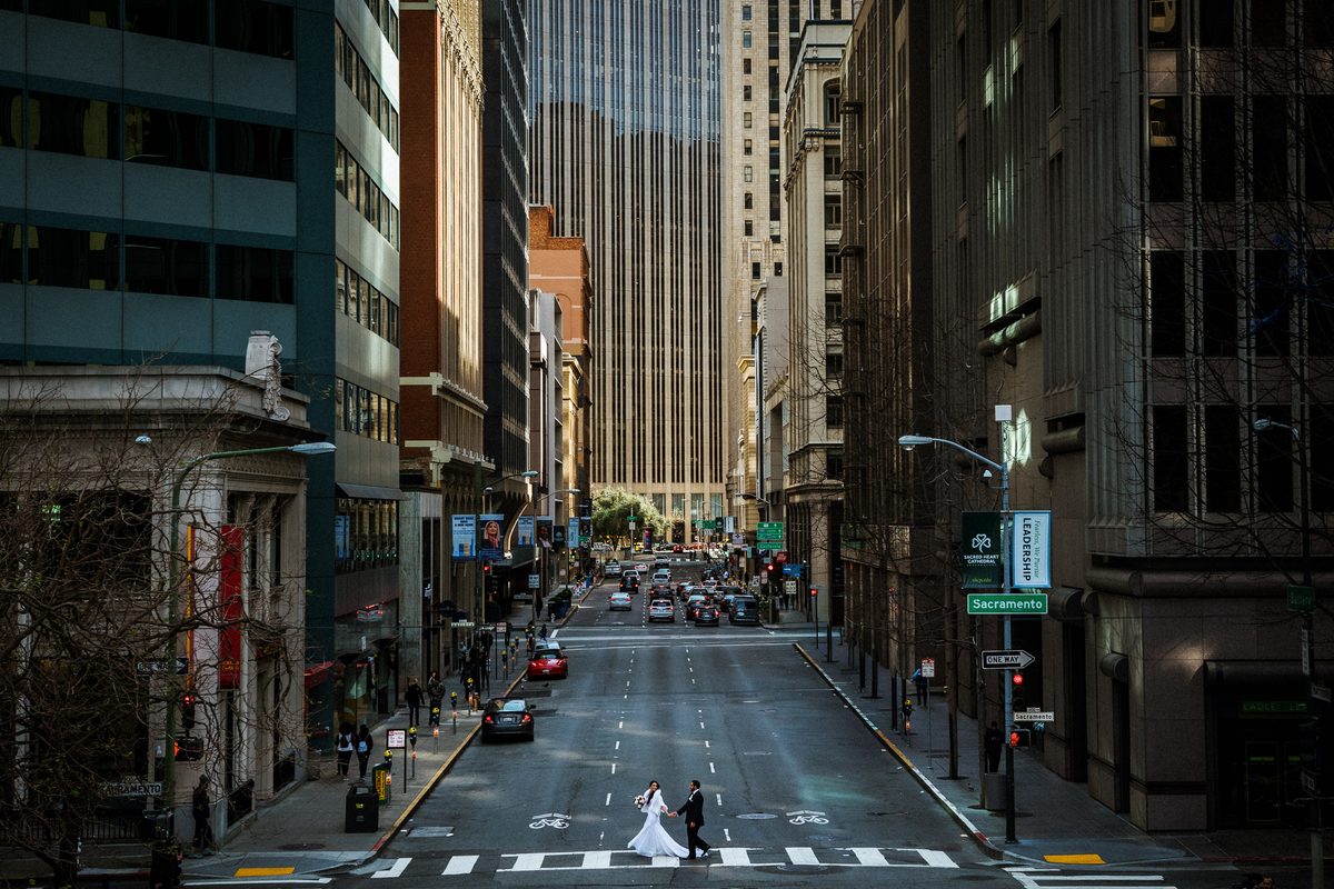 Bride in an empty Financial District intersection during her San Francisco wedding portrait session